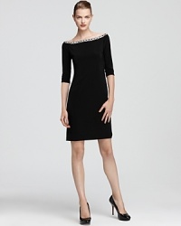 Basix's stunning off-the-shoulder dress lends sophisticated glamour with a jeweled neckline. Basix's stunning off-the-shoulder dress lends sophisticated glamour with a jeweled neckline.