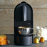 The ultimate in coffee convenience, the U from Nespresso heats up in just 25-30 seconds and powers off automatically after nine minutes. Detailed with water level detection, a folding drip tray and a sleek, compact profile that easily fits into small spaces. The ultimate in coffee convenience, the U from Nespresso heats up in just 25-30 seconds and powers off automatically after nine minutes. Detailed with water level detection, a folding drip tray and a sleek, compact profile that easily fits into small spaces.