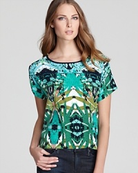 Work a taste of paradise into the everyday with this Sam & Lavi top in a vivid kaleidoscope print. Work a taste of paradise into the everyday with this Sam & Lavi top in a vivid kaleidoscope print.