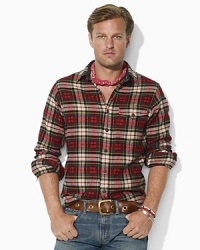 A handsome throat latch and patch pocket at the chest lend a hint of rugged flair to a classic button-down in plaid cotton twill. A handsome throat latch and patch pocket at the chest lend a hint of rugged flair to a classic button-down in plaid cotton twill.