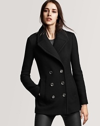 Classic tailoring and wide lapels make this chic peacoat elegant and refined. Classic tailoring and wide lapels make this chic peacoat elegant and refined.