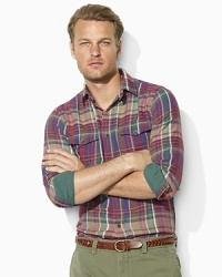 A trim-fitting sport shirt is crafted from soft double-faced twill with a bold plaid print and military-inspired details, making it a rugged wardrobe favorite. A trim-fitting sport shirt is crafted from soft double-faced twill with a bold plaid print and military-inspired details, making it a rugged wardrobe favorite.