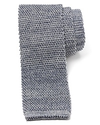 A shimmering tie with a retro cut and skinny width offsets your shirting with panache for a fetching overall look. A shimmering tie with a retro cut and skinny width offsets your shirting with panache for a fetching overall look.