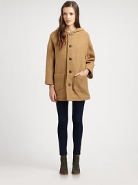 Cozy up to this oversized wool coat with an attached hood, dropped shoulders and emphasized front patch pockets. Attached hoodDropped shouldersLong sleevesButton frontFront patch pocketsFully linedAbout 30 from shoulder to hemWoolDry cleanImported of French fabricModel shown is 5'10 (177cm) wearing US size Small.This style runs true to size. We recommend ordering your usual size for a standard fit. Cozy up to this oversized wool coat with an attached hood, dropped shoulders and emphasized front patch pockets. Attached hoodDropped shouldersLong sleevesButton frontFront patch pocketsFully linedAbout 30 from shoulder to hemWoolDry cleanImported of French fabricModel shown is 5'10 (177cm) wearing US size Small.This style runs true to size. We recommend ordering your usual size for a standard fit.
