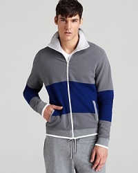 A stripe of color and the contrast interior collar and trim enhance this mellow track jacket, the perfect hang-out uniform with a pair of edgy jeans. Oh, and it's reversible, too, giving you a second option whenever you like. A stripe of color and the contrast interior collar and trim enhance this mellow track jacket, the perfect hang-out uniform with a pair of edgy jeans. Oh, and it's reversible, too, giving you a second option whenever you like.