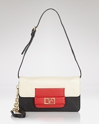 DIANE von FURSTENBERG's vintage-inspired style gets day-to-night right with this clutch, crafted of leather and detailed with a snap closure. Everything about this convertible bag is major (except its size.) DIANE von FURSTENBERG's vintage-inspired style gets day-to-night right with this clutch, crafted of leather and detailed with a snap closure. Everything about this convertible bag is major (except its size.)