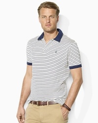 Tailored with a wider body and longer hem, a classic-fitting striped polo is designed for easy movement and breathability in luxurious cotton lisle. Tailored with a wider body and longer hem, a classic-fitting striped polo is designed for easy movement and breathability in luxurious cotton lisle.