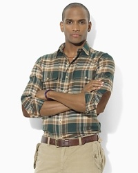 Putting a preppy twist on the rugged outdoors look, this classic-fitting plaid workshirt is rendered in soft, brushed cotton twill with supple goat suede elbow patches. Putting a preppy twist on the rugged outdoors look, this classic-fitting plaid workshirt is rendered in soft, brushed cotton twill with supple goat suede elbow patches.