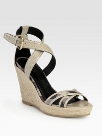 The iconic Burberry check in coated canvas mixes with smooth patent leather in this neutral espadrille wedge silhouette. Covered wedge, 3¾ (95mm)Covered platform, 1 (25mm)Compares to a 2¾ heel (70mm)Patent leather and coated canvas upperAdjustable ankle strapLeather liningRubber solePadded insoleMade in Spain The iconic Burberry check in coated canvas mixes with smooth patent leather in this neutral espadrille wedge silhouette. Covered wedge, 3¾ (95mm)Covered platform, 1 (25mm)Compares to a 2¾ heel (70mm)Patent leather and coated canvas upperAdjustable ankle strapLeather liningRubber solePadded insoleMade in Spain