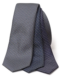 A classic silk tie, rendered in a subtle box pattern for dashing workday style. A classic silk tie, rendered in a subtle box pattern for dashing workday style.