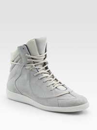 A high-top design that could only come from the House of Margiela, mixing leather, suede and patent leather to dramatic effect. Rubber soleMade in Italy A high-top design that could only come from the House of Margiela, mixing leather, suede and patent leather to dramatic effect. Rubber soleMade in Italy