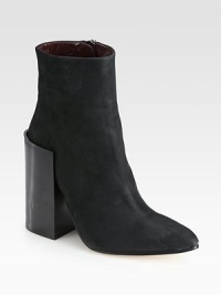 An exaggerated wooden heel heightens this modern leather ankle boot with a subtle point toe. Wooden heel, 4¾ (120mm)Leather upperPoint toeSide zipLeather lining and solePadded insoleMade in Italy An exaggerated wooden heel heightens this modern leather ankle boot with a subtle point toe. Wooden heel, 4¾ (120mm)Leather upperPoint toeSide zipLeather lining and solePadded insoleMade in Italy