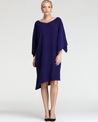 The classic Tahari Woman Plus dress gets a contemporary update with an angled hem and oversized split sleeves for a thoroughly modern silhouette. The classic Tahari Woman Plus dress gets a contemporary update with an angled hem and oversized split sleeves for a thoroughly modern silhouette.