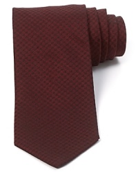 A subtle pattern adorns this plush Italian silk tie for a handsome addition to your fine dressed-up wardrobe. A subtle pattern adorns this plush Italian silk tie for a handsome addition to your fine dressed-up wardrobe.