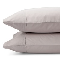 Alternating bands of luxurious matte and shiny silk, trimmed in airy chiffon elevate a simple bedding ensemble. Sheets and pillowcases are simple, soft 410-thread count Egyptian cotton with a saddle stitch hem.