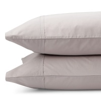 Alternating bands of luxurious matte and shiny silk, trimmed in airy chiffon elevate a simple bedding ensemble. Sheets and pillowcases are simple, soft 410-thread count Egyptian cotton with a saddle stitch hem. Alternating bands of luxurious matte and shiny silk, trimmed in airy chiffon elevate a simple bedding ensemble. Sheets and pillowcases are simple, soft 410-thread count Egyptian cotton with a saddle stitch hem.
