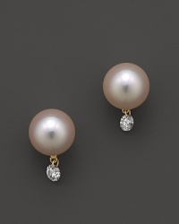 A timeless classic, these Tara Pearls earrings pair a cultured Akoya pearl with a sparkling diamond accent. A timeless classic, these Tara Pearls earrings pair a cultured Akoya pearl with a sparkling diamond accent.
