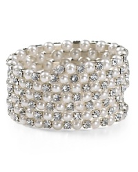 Detailed with sparkling rhinestones, Aqua's pearly coil bracelet lends a dressed up, sophisticated look. Detailed with sparkling rhinestones, Aqua's pearly coil bracelet lends a dressed up, sophisticated look.