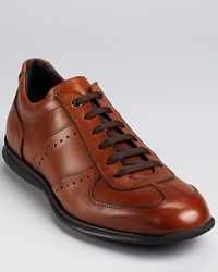 The best of both worlds? To Boot New York's hybrid sport shoe blends the comfort and profile of a sneaker with the fine leather detailing of an oxford. The best of both worlds? To Boot New York's hybrid sport shoe blends the comfort and profile of a sneaker with the fine leather detailing of an oxford.