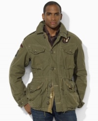 Embrace your rugged side with the essential military twill combat jacket, accented by various notes of weathered wear for a broken-in feel. Embrace your rugged side with the essential military twill combat jacket, accented by various notes of weathered wear for a broken-in feel.