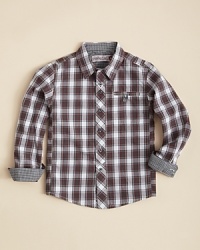 This traditional check button down gets update with a cool double-besom chest pocket with a check grossgrain button tab closure, as well as an extra button below the collar for more control over his neckline.