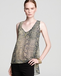 Ever-chic snake print adorns this breezy Aqua top, flaunting an on-trend high-low hemline. Ever-chic snake print adorns this breezy Aqua top, flaunting an on-trend high-low hemline.