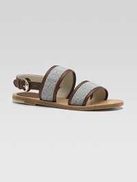 Wide straps of signature GG fabric in a denim-like jacquard with rich leather trim.Fabric upperLeather buckle ankle strap and trimGolden buckleLeather sole with non-slip rubber finishMade in Italy Wide straps of signature GG fabric in a denim-like jacquard with rich leather trim.Fabric upperLeather buckle ankle strap and trimGolden buckleLeather sole with non-slip rubber finishMade in Italy