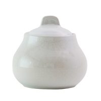 These carefully handmade, weighty ceramic dishes from Jars are each artfully highlighted by a rich, glossy crackle finish in a subdued celadon hue. These carefully handmade, weighty ceramic dishes from Jars are each artfully highlighted by a rich, glossy crackle finish in a subdued celadon hue.