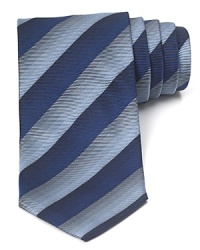 Thick tonal stripes augment your handsome professional look with this soft tie cut in a classic width for timeless appeal. Thick tonal stripes augment your handsome professional look with this soft tie cut in a classic width for timeless appeal.