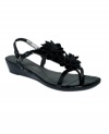Embrace the season with the Vivian sandals by Adrienne Vittadini. Twin flower accents trim the vamp and a stacked wedge is just high enough to give you a comfortable boost.