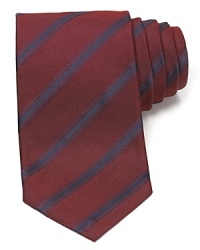 Maintain your polished appearance with this dignified silk tie, cut in a classic width for traditional appeal and patterned with a handsome stripe design. Maintain your polished appearance with this dignified silk tie, cut in a classic width for traditional appeal and patterned with a handsome stripe design.