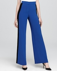 A high waist and wide leg lend sophistication to these Trina Turk pants, fashioned in statement-making blocked colors. A high waist and wide leg lend sophistication to these Trina Turk pants, fashioned in statement-making blocked colors.