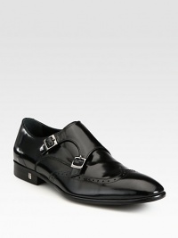 A double monk strap closure lends a modern, refined touch to a classic slip-on style, crafted in sleek, polished calfskin leather.Leather upperLeather liningPadded insoleRubber soleImported A double monk strap closure lends a modern, refined touch to a classic slip-on style, crafted in sleek, polished calfskin leather.Leather upperLeather liningPadded insoleRubber soleImported