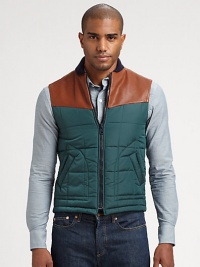 Casual vest adds a layer of warmth and style in this modern combo of leather and nylon.Front zipperSide pocketsLeather shouldersAbout 24 from shoulder to hemPolyamide/polyesterDry clean by leather specialistMade in Italy Casual vest adds a layer of warmth and style in this modern combo of leather and nylon.Front zipperSide pocketsLeather shouldersAbout 24 from shoulder to hemPolyamide/polyesterDry clean by leather specialistMade in Italy