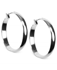 Go full circle with this set of hoop earrings from Anne Klein. Crafted from silver-tone mixed metal, the pair makes a subtle, yet bold statement. Approximate diameter: 1-1/4 inches. Go full circle with this set of hoop earrings from Anne Klein. Crafted from silver-tone mixed metal, the pair makes a subtle, yet bold statement. Approximate diameter: 1-1/4 inches.