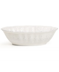 Embossed designs and a delicate scalloped edge with distressed detail give the Blanc oval serving bowl the classic, romantic feel of Versailles Maison's dinnerware collection.