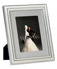Always look elegant within the Chime picture frame from Vera Wang. Luxe silver plate with clean lines and beveled edges makes a lasting impression all its own. Interior rim features classic ribbed detail. Always look elegant within the Chime picture frame from Vera Wang. Luxe silver plate with clean lines and beveled edges makes a lasting impression all its own. Interior rim features classic ribbed detail.