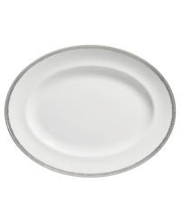 Vera Wang marries modern shapes with traditional lace in this set of dinnerware. The dishes are decidedly timeless. Platinum trim and banding add delicate feminine touches to this white oval platter. Vera Wang marries modern shapes with traditional lace in this set of dinnerware. The dishes are decidedly timeless. Platinum trim and banding add delicate feminine touches to this white oval platter.