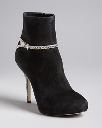Slim, snake-embossed ankle straps and heels define these black booties by IVANKA TRUMP. Dressed enough for the office and evenings out, they are a versatile must-have. Slim, snake-embossed ankle straps and heels define these black booties by IVANKA TRUMP. Dressed enough for the office and evenings out, they are a versatile must-have.