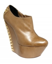 Nothing ordinary about this fashion-forward pair. Betsey Johnson's Maysy platform wedge booties feature sexy corset-style lace-up details on the back. Nothing ordinary about this fashion-forward pair. Betsey Johnson's Maysy platform wedge booties feature sexy corset-style lace-up details on the back.