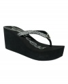 Keep your summer style sizzling with glamorous Sabrah wedge flip flops by GUESS.