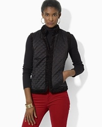 A luxurious quilted vest reverses to a plush faux-shearling side, doubling the glamorous wardrobe-styling options for the modern woman A luxurious quilted vest reverses to a plush faux-shearling side, doubling the glamorous wardrobe-styling options for the modern woman