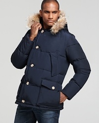 The inclement weather doesn't stand a chance against this formidable coat from WOOLRICH JOHN RICH & BROS, trimmed with fur on the hood to give your winter wardrobe a luxe touch. The inclement weather doesn't stand a chance against this formidable coat from WOOLRICH JOHN RICH & BROS, trimmed with fur on the hood to give your winter wardrobe a luxe touch.