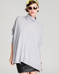 Rendered with a warm turtleneck, this oversized Aqua Cashmere sweater flows fluidly over your silhouette into an asymmetric hem. Seam detail at the front and back lends the perfect touch of modernity. Rendered with a warm turtleneck, this oversized Aqua Cashmere sweater flows fluidly over your silhouette into an asymmetric hem. Seam detail at the front and back lends the perfect touch of modernity.