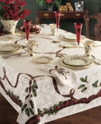 Season's greetings! Traditional holiday motifs of holly and ribbon adorn this durable cotton-blend tablecloth. A festive addition to your holiday décor you'll use year after year. Season's greetings! Traditional holiday motifs of holly and ribbon adorn this durable cotton-blend tablecloth. A festive addition to your holiday décor you'll use year after year.