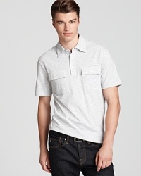 A handsome polo with a thin stripe pattern offers a bit of military appeal with the double pocket detail at the chest. A handsome polo with a thin stripe pattern offers a bit of military appeal with the double pocket detail at the chest.