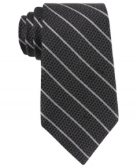 Skinny stripes make a subtle statement that still gets noticed with this DKNY silk tie. Skinny stripes make a subtle statement that still gets noticed with this DKNY silk tie.