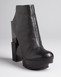 Modern art: These Dolce Vita booties flaunt sensational, geometrically sculptural heels and platforms that make this pair museum quality. Modern art: These Dolce Vita booties flaunt sensational, geometrically sculptural heels and platforms that make this pair museum quality.
