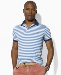 Vibrant pops of color and Ralph Lauren's iconic pony enliven a trim-fitting short-sleeved polo crafted from soft jersey-knit cotton with sleek stripes. Vibrant pops of color and Ralph Lauren's iconic pony enliven a trim-fitting short-sleeved polo crafted from soft jersey-knit cotton with sleek stripes.