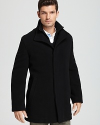 The classic pea coat with a more straightforward silhouette, featuring a concealed zip and button placket for a crisp, clean look. The classic pea coat with a more straightforward silhouette, featuring a concealed zip and button placket for a crisp, clean look.
